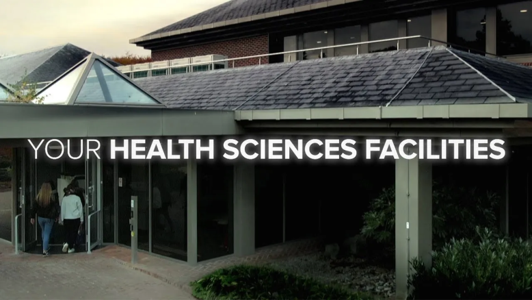 Still from Your Health Sciences facilities video showing title and building